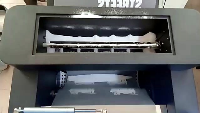Film passing through the curing dryer