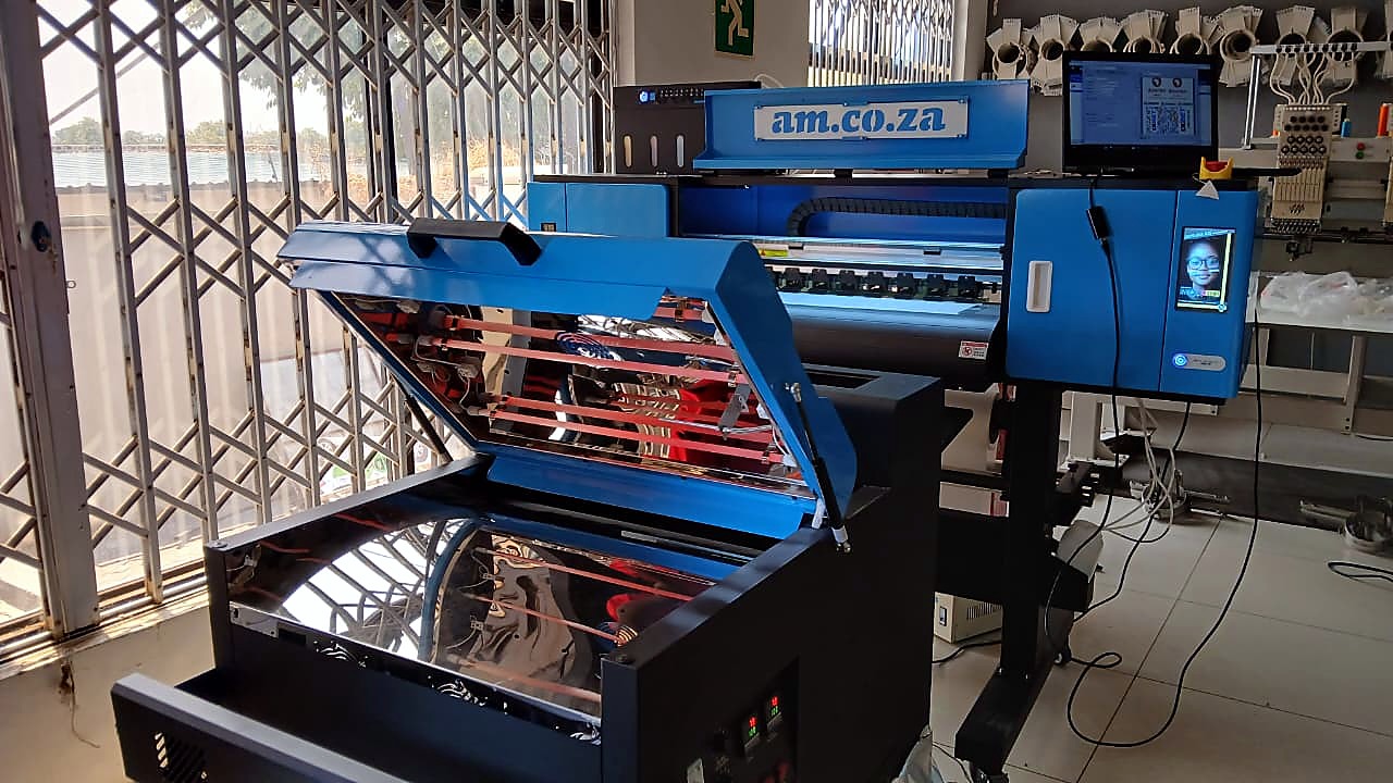 H-DTF/600/XP600: blue am.co.za 600mm DTF printer with its powder shaker/curing unit open (submitted still)