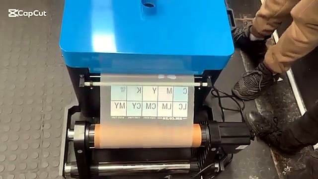 Colour grid film with AM.CO.ZA text over orange roller (SKU ask)