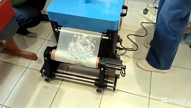 Blue powder/cure unit film take-up with circular print (SKU ask)