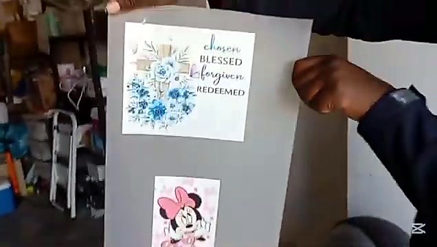 Hand holds floral + Minnie transfer sheet (SKU ask)
