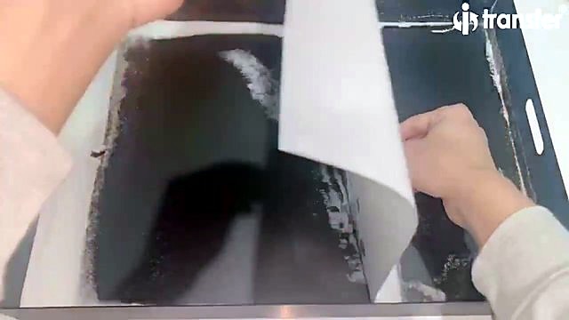 Powdered DTF film lifted from oven bed (SKU ask)