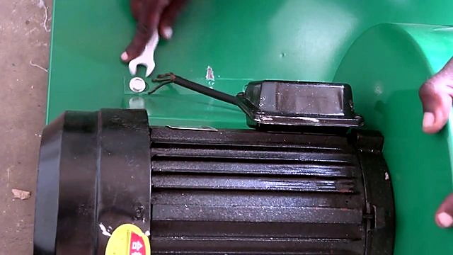 Black motor mounted on green dust-collector base (SKU ask)