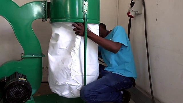 White fabric bag under green separator drum (SKU ask)