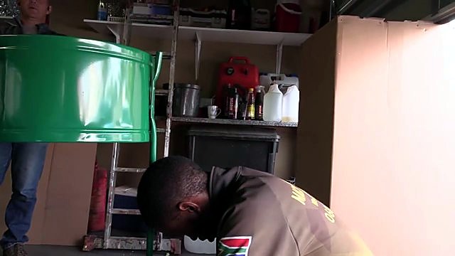 Green 220V bag dust-collector drum during install (SKU ask)