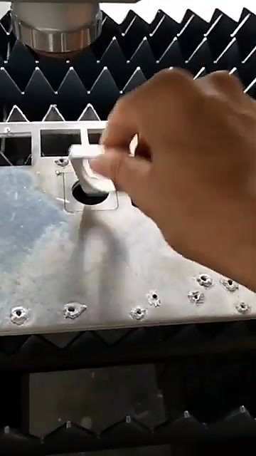 Hands remove aluminum cutouts (SKU ask)