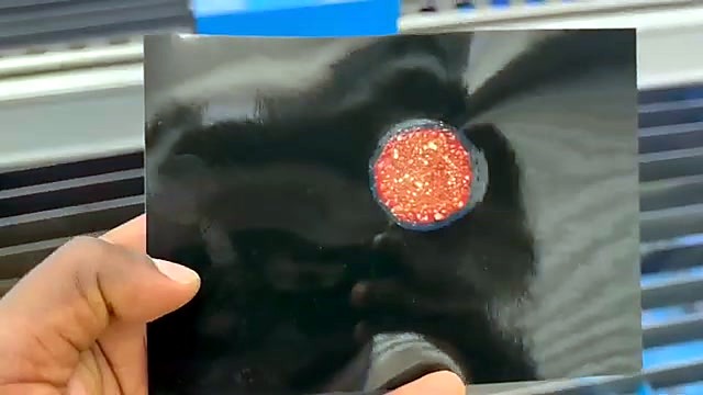 Photo-paper burn spot used to check the fiber laser lens and beam on the RayCUT Lite
