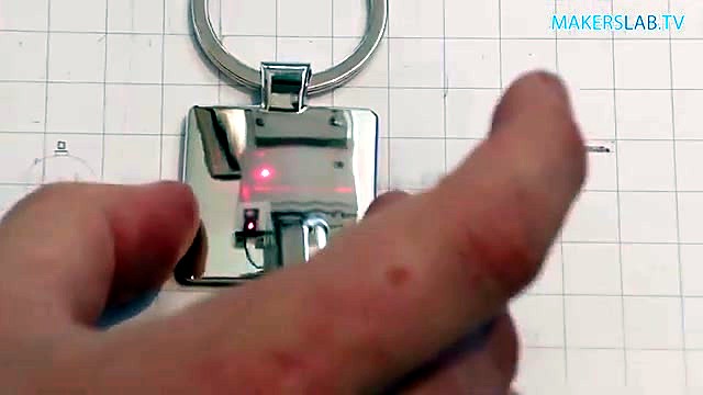 Red pointer framing metal keyring under galvo (SKU ask)