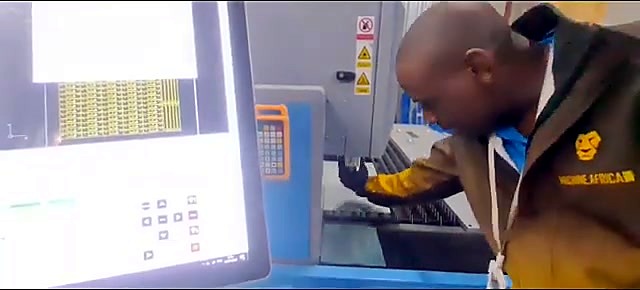 AM.CO.ZA tech at fiber cutting bed (SKU ask)