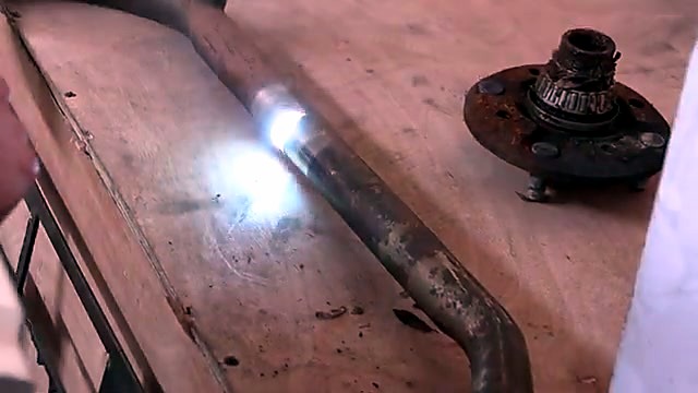 Bright beam cleaning rust on metal pipe (SKU ask)