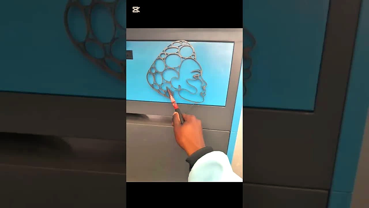 Face metal cutout showcased on blue panel (SKU ask)