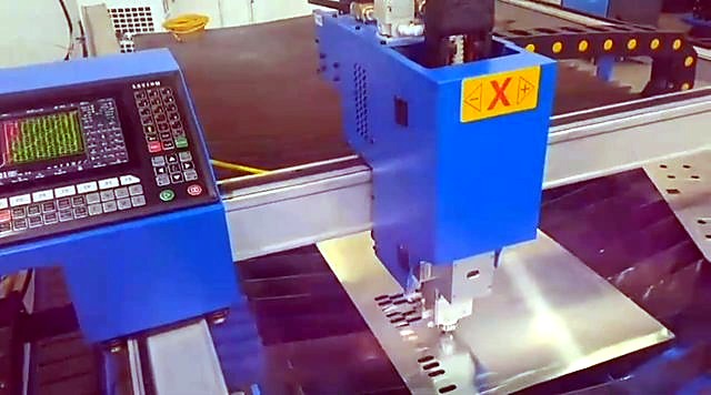 Fibre gantry cutting checker squares in metal sheet (SKU ask)
