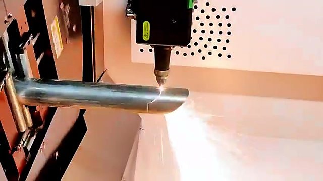 Fibre head cutting round metal pipe with sparks (SKU ask)