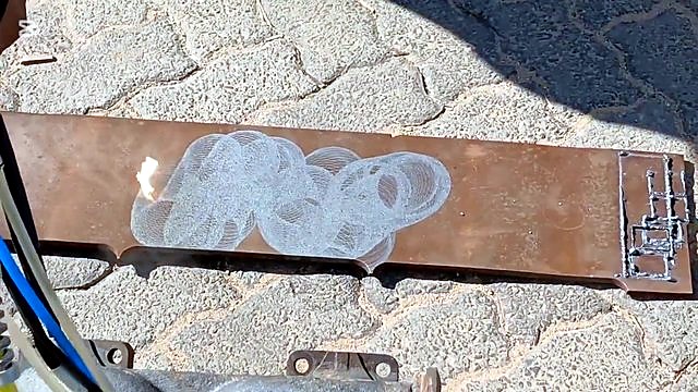 Circular swirl clean pattern on rusty flat plate (SKU ask)