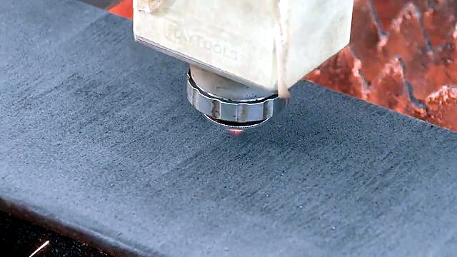 Raytools cutting head over thick mild-steel plate (SKU ask)