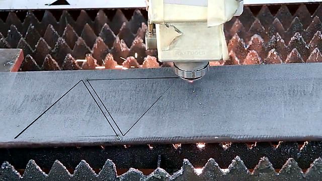 Triangle nest cuts on serrated slat bed under laser head (SKU ask)