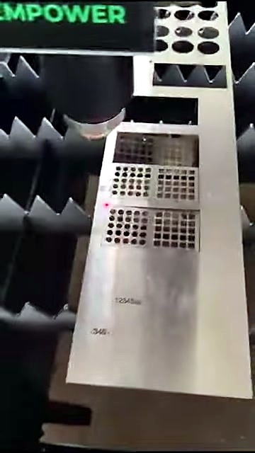 Dense square-hole grill/mesh pattern under laser head (SKU ask)
