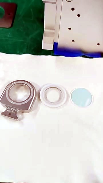 Disassembled lens + white gasket + holder on cloth (SKU ask)