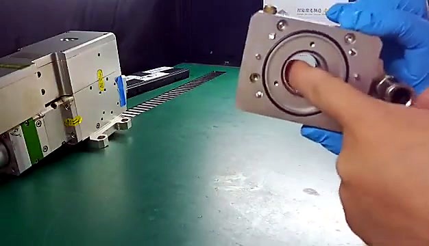 Finger indicates central optic bore / seat (SKU ask)