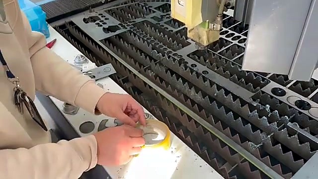Hand lifting cut parts from nested sheet (SKU ask)
