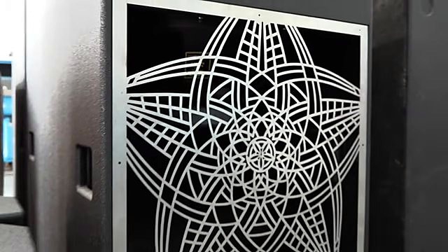 Finished five-point star geometric grill on black speaker cabinet (SKU ask)