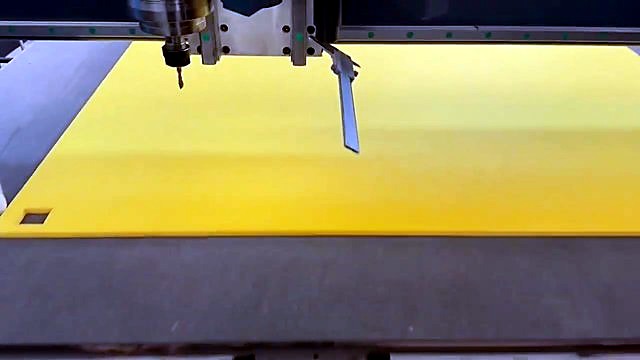 Spindle bit + angled knife/probe over yellow sheet (SKU ask)