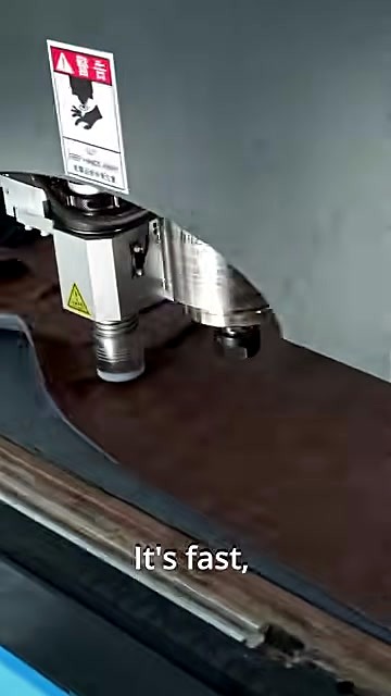 Dual-tool head cutting leatherette strip path; KEEP HANDS AWAY label (SKU ask)