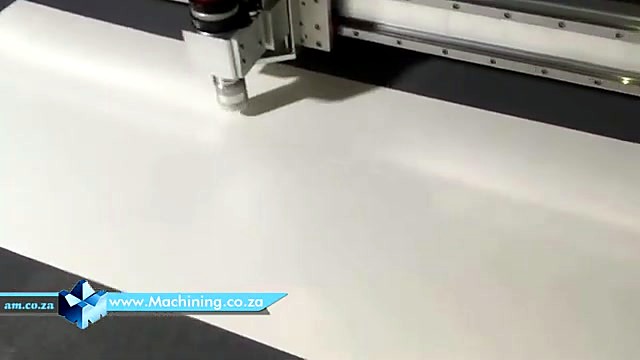 Red oscillating knife head cutting white board (SKU ask)
