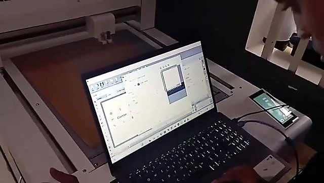 Laptop control beside FlatCUT bed cardboard job (SKU ask)