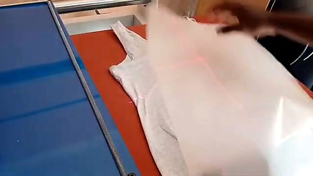Red laser line aligning transfer on garment (SKU ask)