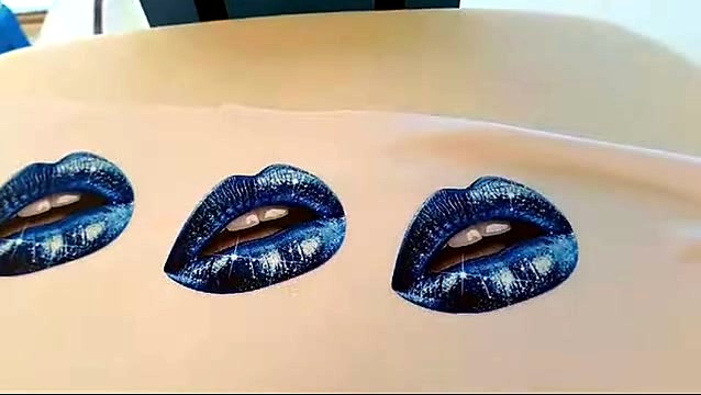 Pressed blue glitter lip graphics on white garment (SKU ask)