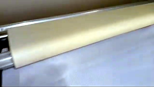 Beige roller feeding white fabric (SKU ask)