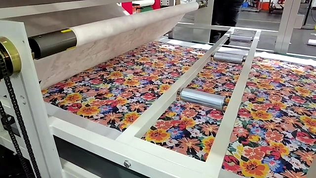 Floral sublimated fabric exiting drum (SKU ask)