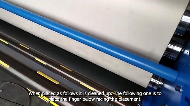 White roll media feeding into H-ROLLER drum path (SKU ask)