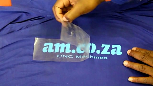 Peeling am.co.za CNC Machines transfer from blue fabric (SKU ask)