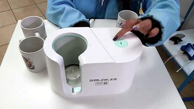 Glowing green start button while loading taped mug (SKU ask)