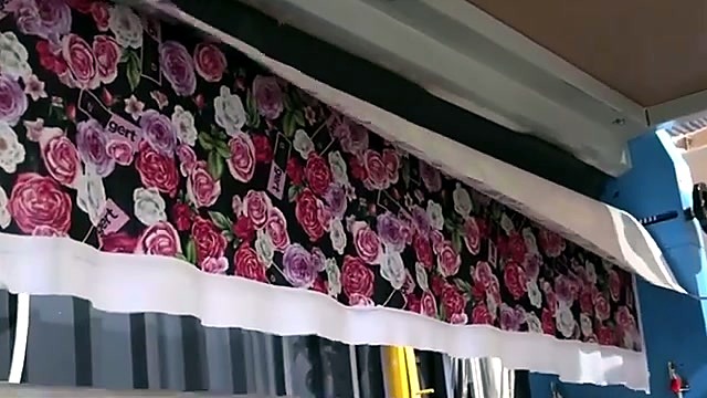 Floral sublimation fabric through rollers densify (SKU ask)