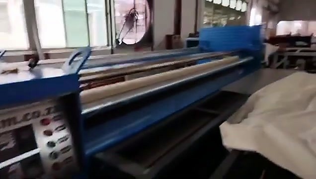White substrate feeding into blue am.co.za roller (SKU ask)