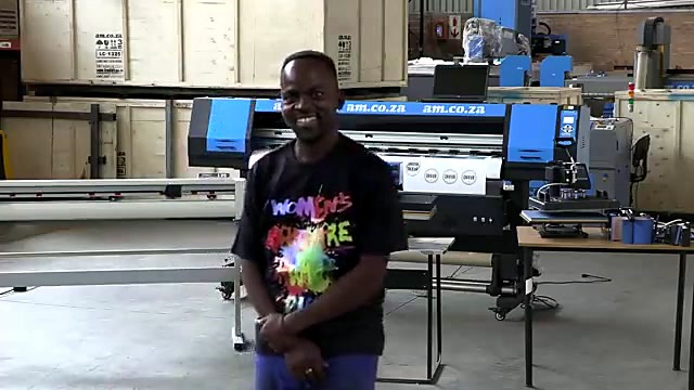 Presenter beside am.co.za blue LF printer (SKU ask)