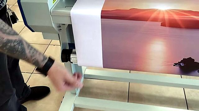 Printed media feeding into Rollman rollers (SKU ask)