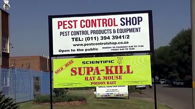 Finished outdoor pest-control laminated signs installed (SKU ask)