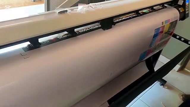 Laptop control station beside printer (SKU ask)