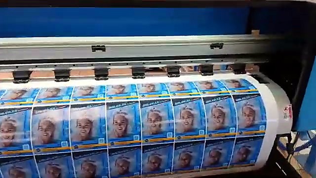 Pinch rollers + take-up with printed posters hanging (SKU ask)