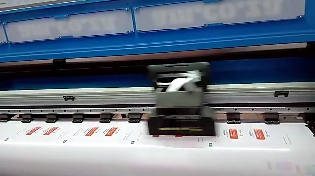 Rows of small red artworks printed on vinyl under the carriage