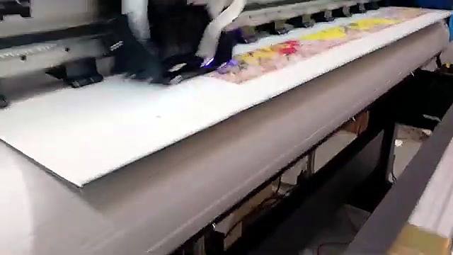 Graffiti mid-print under UV carriage (SKU ask)