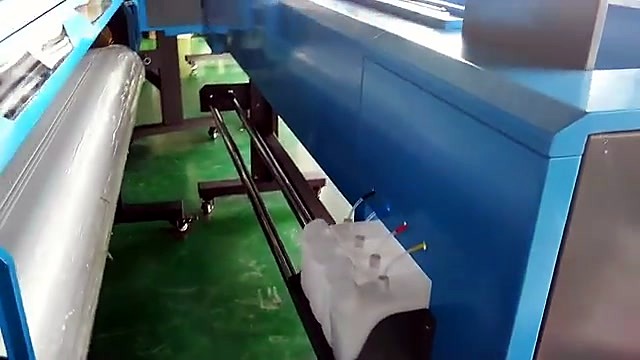 Rear bulk CMYK ink tanks + media feed (SKU ask)