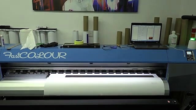 Blue FastCOLOUR-labeled printer with canvas roll (SKU ask)