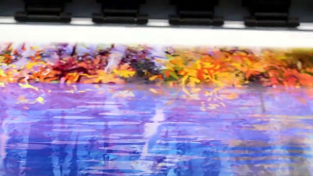 Print carriage close depositing ink on white media (SKU ask)