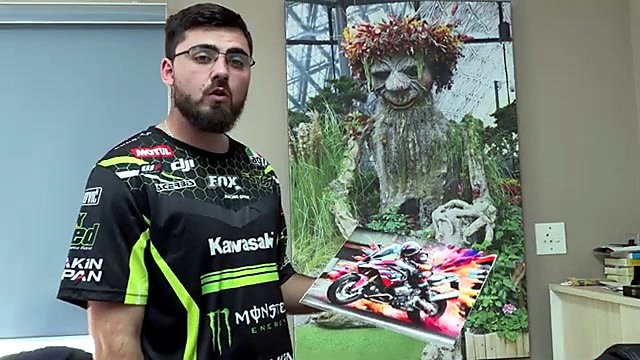 Finished sublimated aluminium motorcycle held to camera (SKU ask)