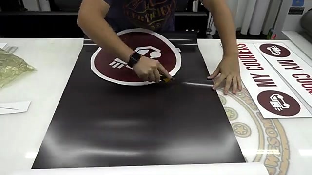 Hand-cut circular maroon truck logo (SKU ask)